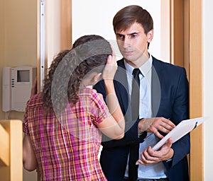 Angry man with documents meeting girl