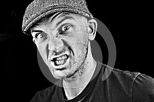 Angry man in grey cap