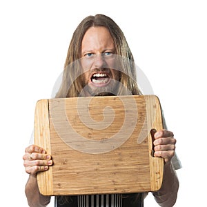 Angry man holding chopping board with copy-space