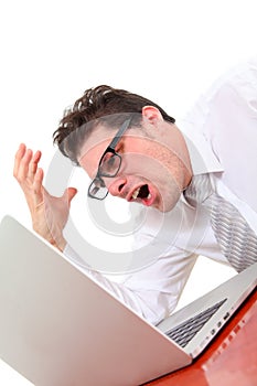 Angry man with laptop on white background