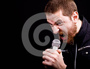 Angry man and loud scream at microphone