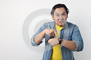 Angry man Pointing at Wristwatch