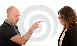 Angry man pointing at young woman
