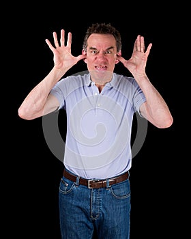 Angry Man Poking Out Tongue with Hands in Ears