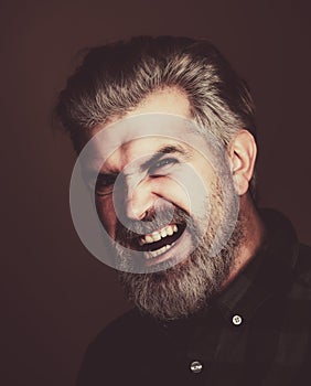 Angry Man. Portrait of a happy man over gray background. Fashion style portrait of handsome guy. Handsome young man on