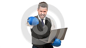 angry man punching with fist in boxing glove hold computer, anger