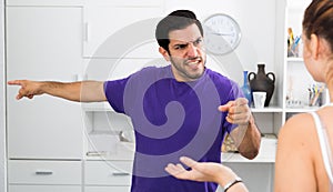 Angry man in quarrel with girl