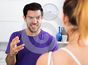 Angry man in quarrel with girl