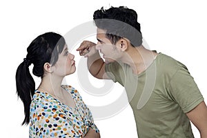 Angry man scolding his wife