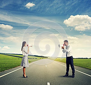 Angry man and screaming woman on the road