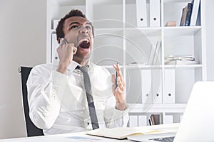 Angry man shouting on phone
