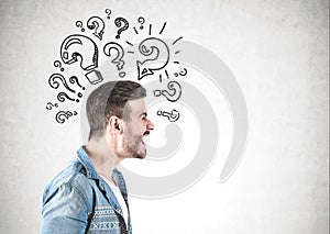 Angry man shouting, question marks