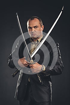 angry man in suit with katana sword