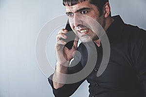 Angry man talking in phone