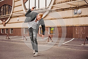 Angry man is throwing away his mobile phone