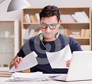 Angry man with too much paperwork to do