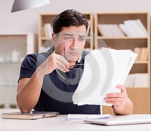 Angry man with too much paperwork to do