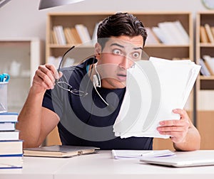 Angry man with too much paperwork to do