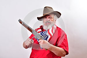 Angry man wearing patriotic colors cocking his short rifle