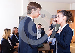 Angry manager and employee at office