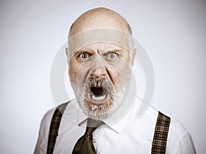 Angry mature man shouting at the camera