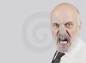 Angry mature man shouting at the camera