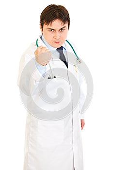Angry medical doctor threaten with fist photo