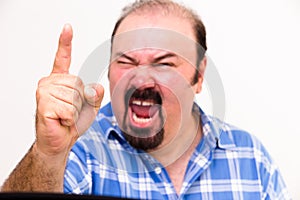 Angry middle-aged man screaming and threatening photo
