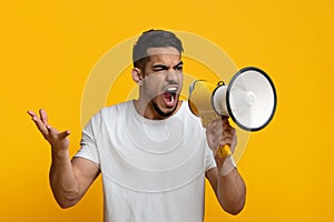 Angry middle eastern guy with loudspeaker gesturing