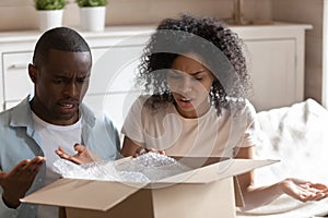 Angry millennial african american married spouse received damaged item.