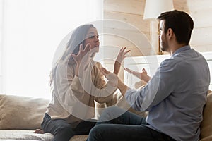 Angry millennial couple have troubles dispute at home