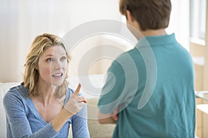 Angry Mother Scolding Son At Home