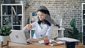 Angry office worker tearing papers and throwing documents in workplace