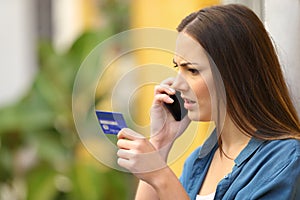 Angry online shopper complaining talking on phone