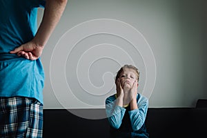 Angry parent looking at tired, ashamed and exhausted kid