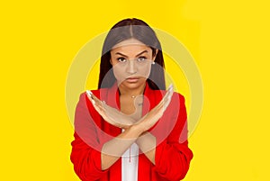 Angry pissed of woman showing stop here, halt with crossed hands