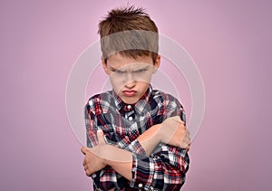 Angry and pouting young boy