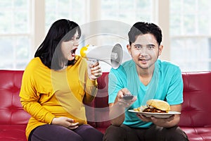 Angry pregnant woman at her husband