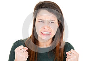 Angry pretty young woman in white background