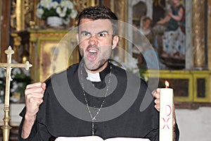 Angry priest shouting out loud