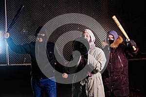 Angry riots with a bat and megaphone, revolt concept photo