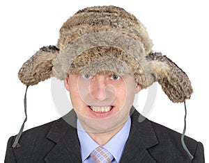 Angry Russian businessman in fur hat on white