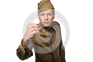 Angry russian soldier threaten with a fist