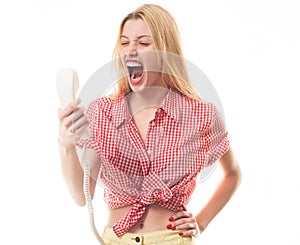 Angry sad blonde woman holding telephone tube. Phone call. Woman shouting a phone, listen bad news. Screaming woman face