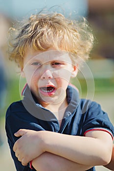 Portrait of young boy craying.