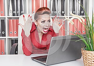 Angry screaming business woman in office