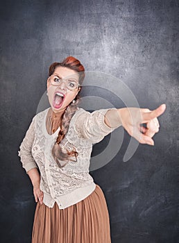 Angry screaming woman pointing out