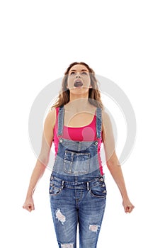 Angry screaming young woman with clenched fist