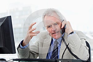 Angry senior manager on the phone