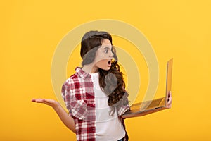 angry shocked teen girl hold laptop during school online lesson, online school